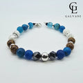 Bracciale artigianale Orizzonte con agata blu ematite e howlite bianca Galvani vista frontale