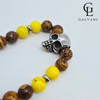 Dettaglio portacellulare bracciale Azteco con giada gialla persiana elephant skin e teschio in acciaio Galvani