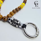 Focus sul teschio del portacellulare bracciale Azteco con giada gialla ed elephant skin Galvani